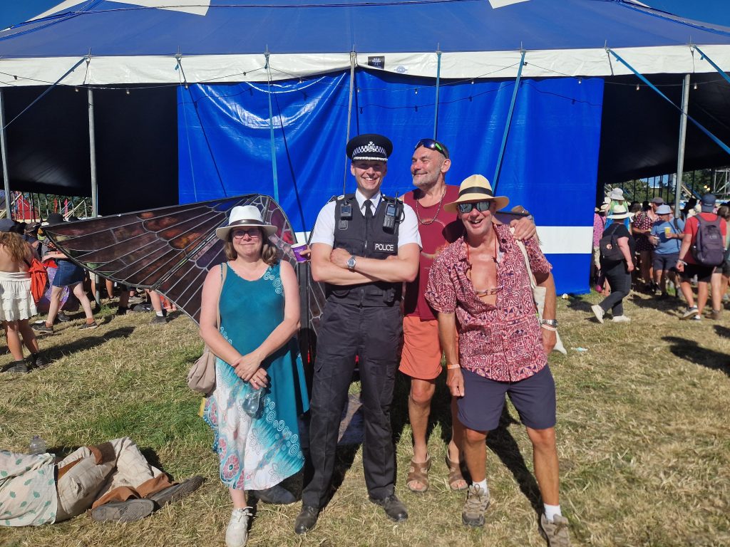 DPCC Claire Hiscott on her Glastonbury walk around. With a local Police Officer and festival goers