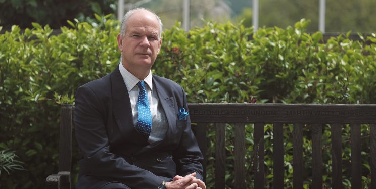 Police and Crime Commissioner Mark Shelford sat on a bench