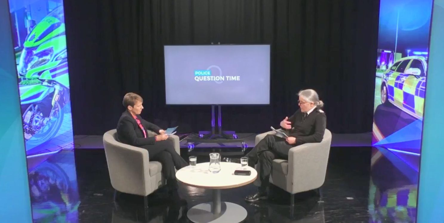An image of Clare interviewing Sarah in a studio with Police Question Time om the TV screen