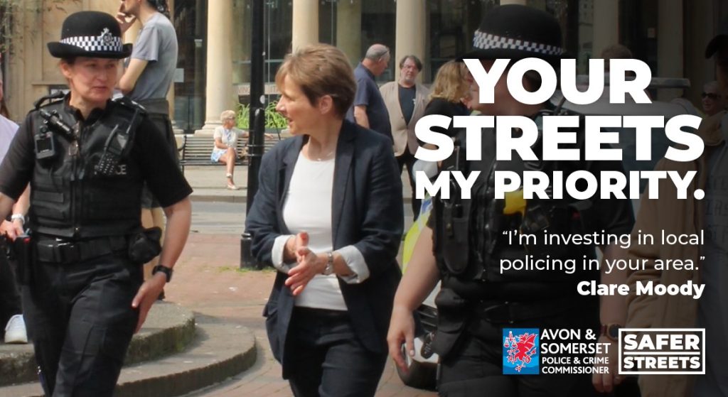 Clare is walking through a town with a police officer, with the wording Your Streets, My Priority. Im investing in local policing in your area. Clare Moody