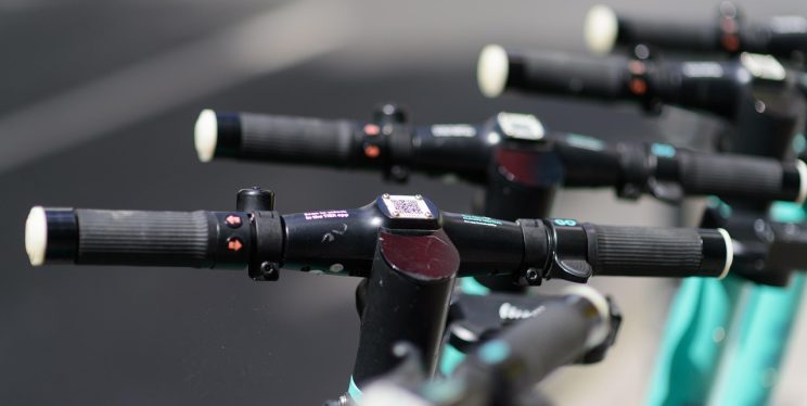 A close up of e-scooter handle bars