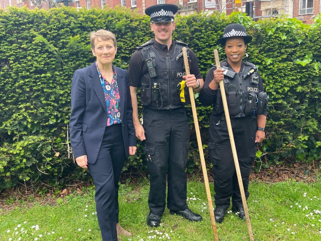 PCC Clare Moody stands besides two police officers in King Square, Bristol