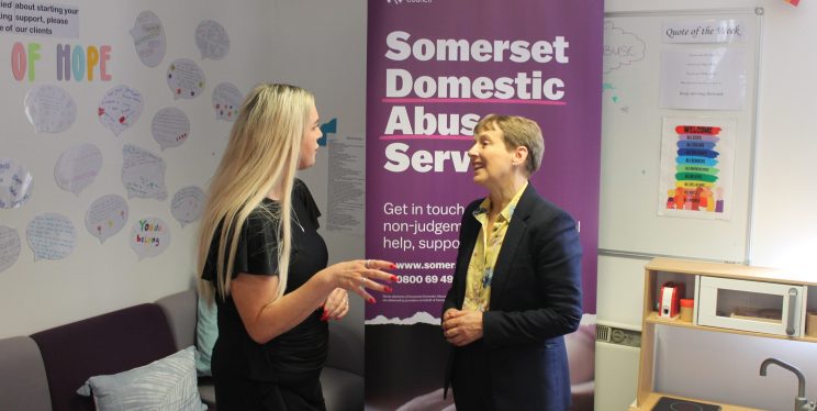 PCC Clare Moody speaks with a member of staff at the Somerset Domestic Abuse Service.